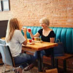 Two ladies having drinks at a brewery