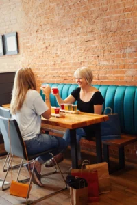 Two ladies having drinks at a brewery